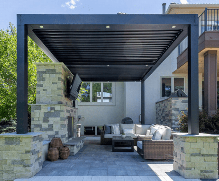 A patio with a fire place and outdoor furniture.