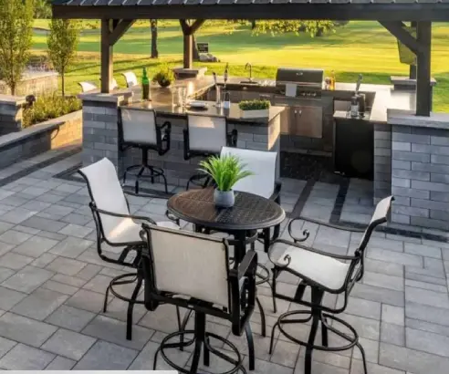 A patio with chairs and tables in it