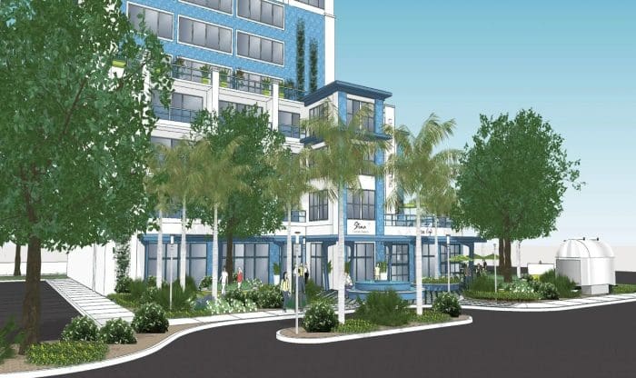 Architectural rendering of a modern multi-story building with glass windows, surrounded by palm trees and greenery, and a road in the foreground.