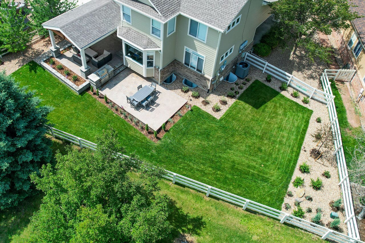 A large backyard with a lawn and garden.