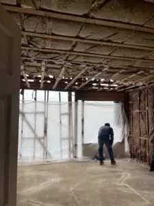 Worker in a room under construction.
