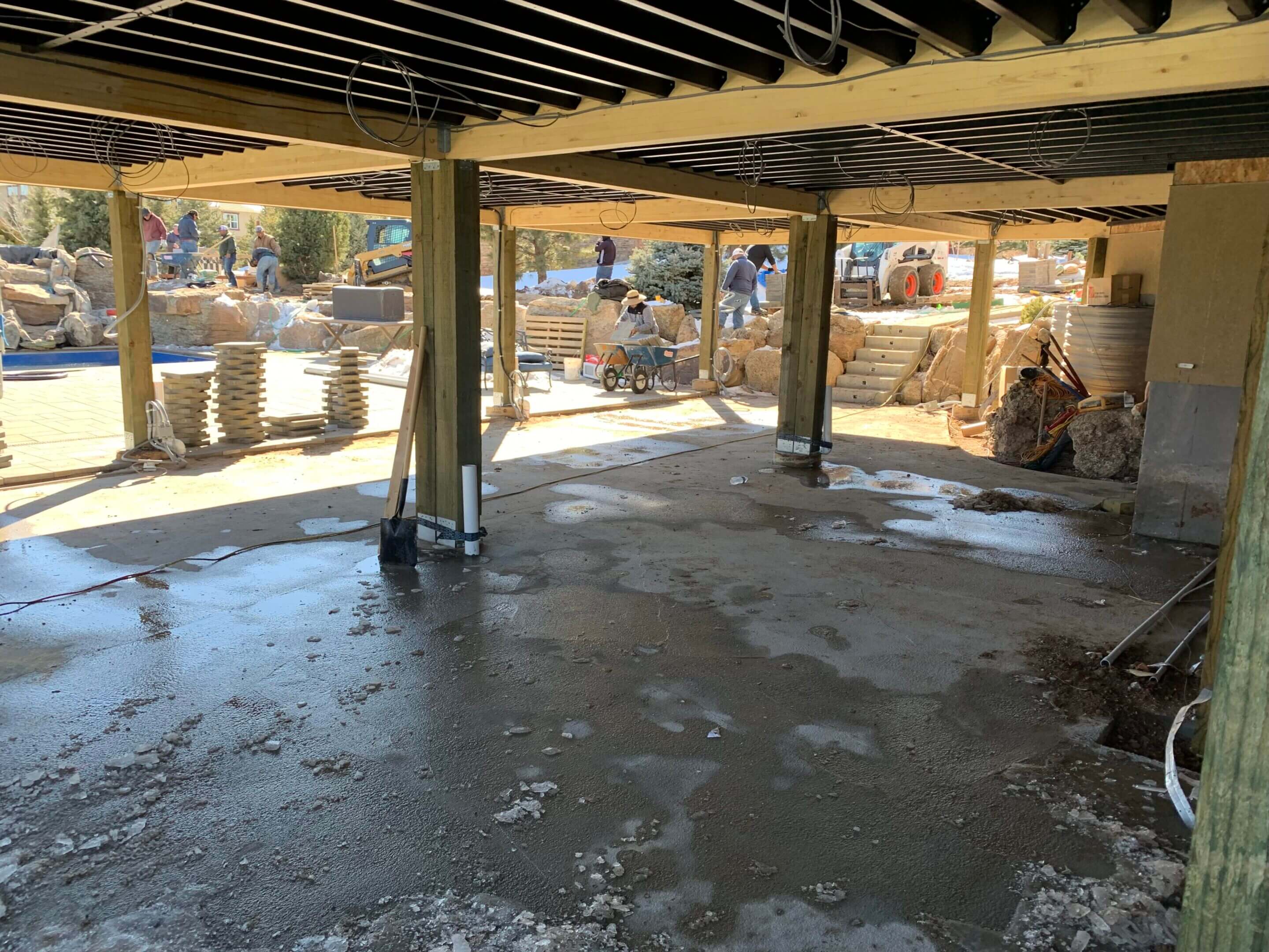 Wet concrete under deck construction.