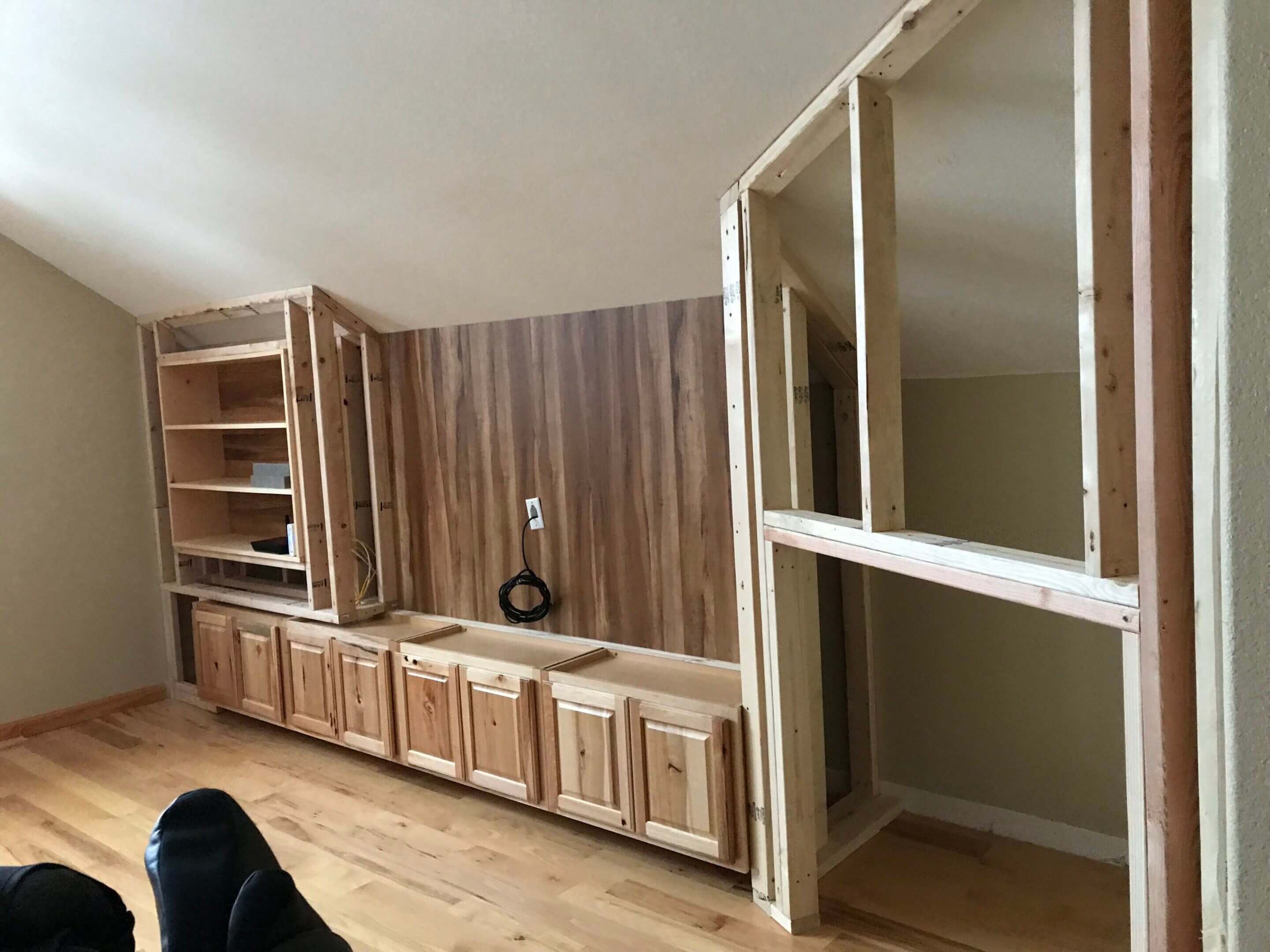 Unfinished wooden entertainment center.
