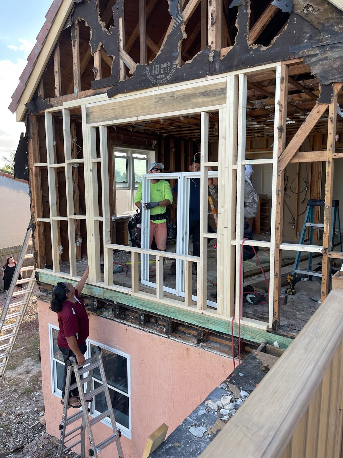 Home renovation: workers installing windows.